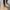 Person on the street with a white cane.